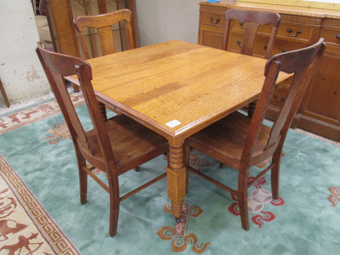 Appraisal: SQUARE OAK DINING TABLE AND A SET OF FOUR OAK