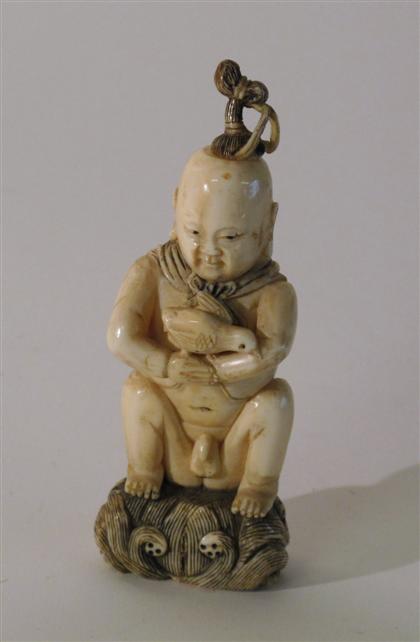 Appraisal: Good Chinese elephant ivory snuff bottleSeated boy over scrolling sea