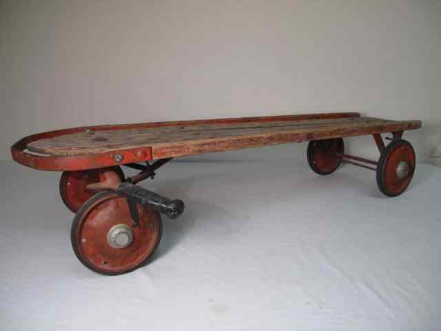 Appraisal: Vintage wooden sled with wheels Measures '' long x ''