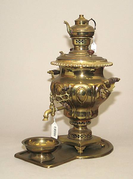 Appraisal: A Russian brass samovar with tray bowl and teapot th