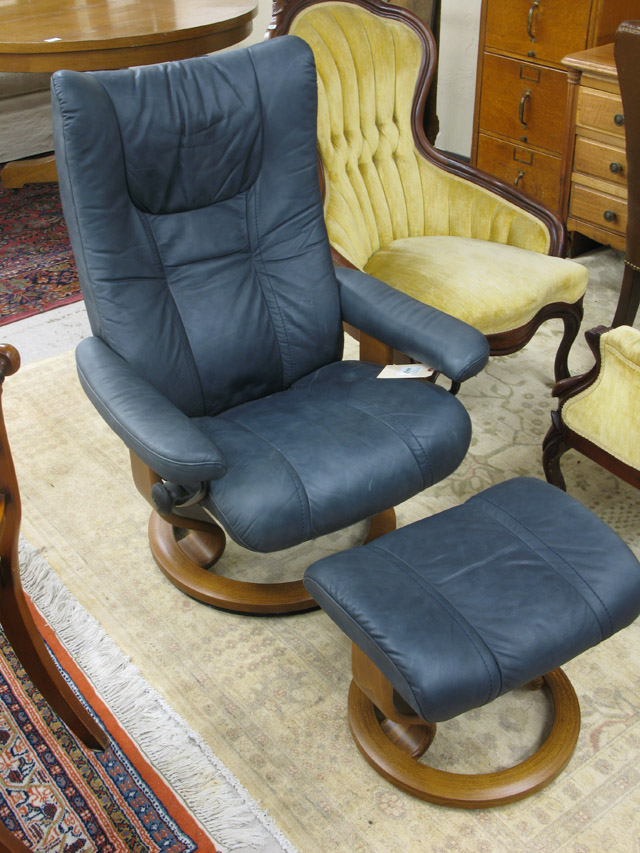 Appraisal: NORWEGIAN MODERN STRESSLESS SWIVEL RECLINER AND MATCHING OTTOMAN J E