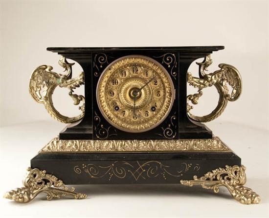 Appraisal: Ansonia Belgium Clock enameled cast-iron case day time and strike