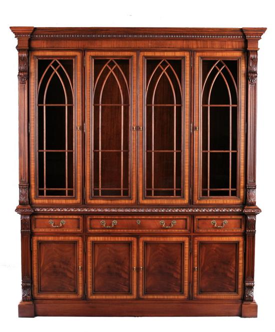 Appraisal: GEORGIAN STYLE GOTHIC-INSPIRED CHINA CABINET th century Reverse-breakfronted form with