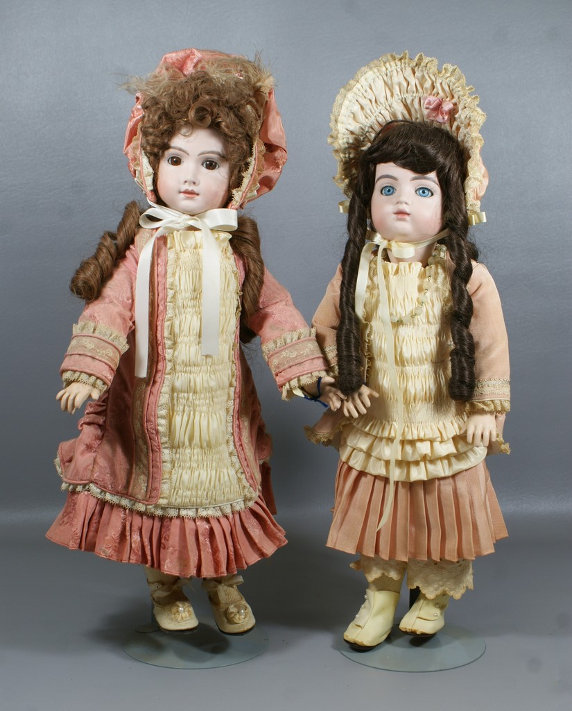 Appraisal: Reproduction French Bisque Dolls brown eyed doll is a reproduction