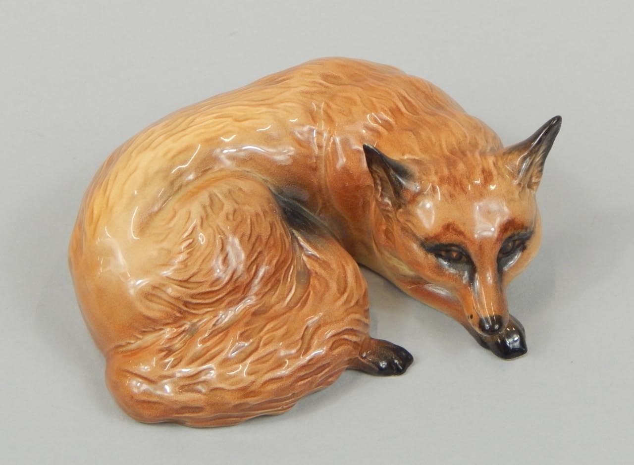 Appraisal: A Beswick figure of a recumbent fox number light brown