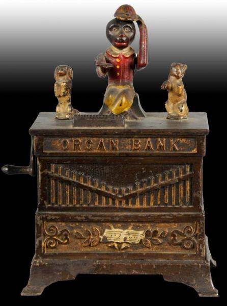 Appraisal: Cast Iron Organ Mechanical Bank Description Dog and cat turn