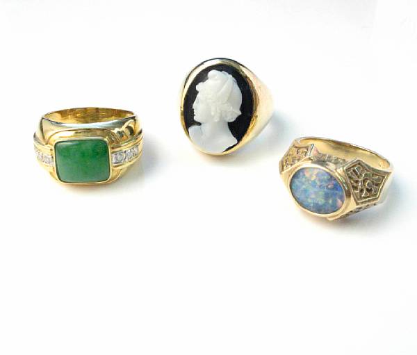 Appraisal: A collection of three gemstone and fourteen karat gold rings