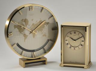 Appraisal: Two brass quartz clocks one with world time Two contemporary