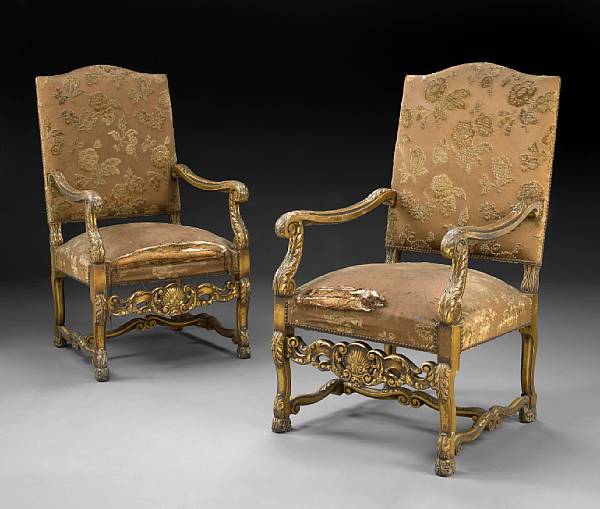 Appraisal: A pair of Louis XIII style carved giltwood fauteuils first