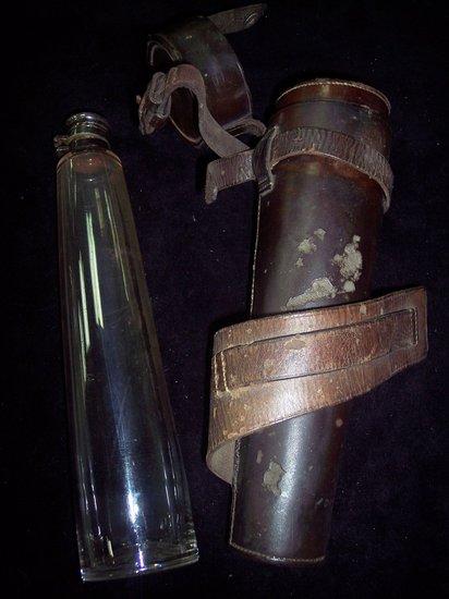 Appraisal: A spirit flask with plated stopper and star cut base