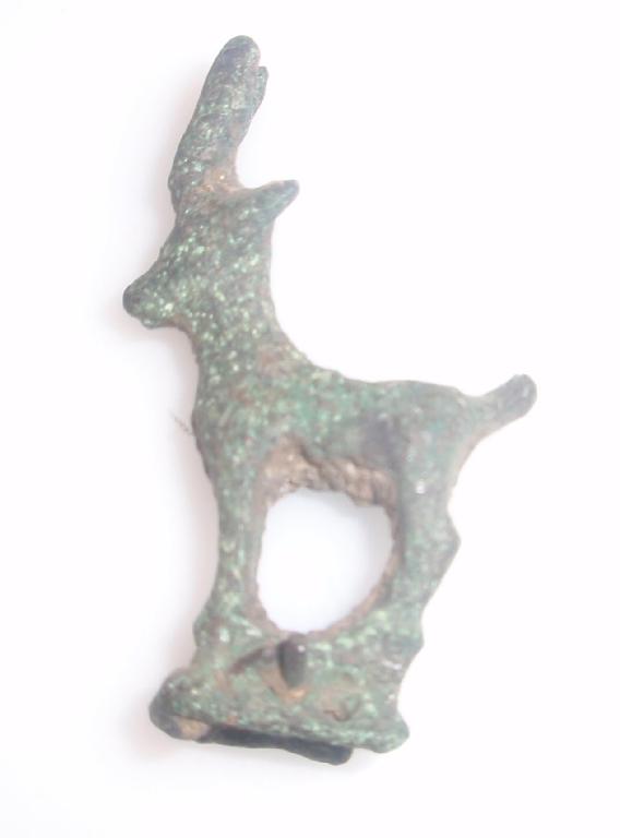 Appraisal: A small Luristan stylized bronze fitting in the form of