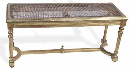 Appraisal: a giltwood and caned long stool in Louis XVI style