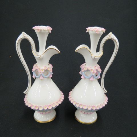 Appraisal: Pair of Porcelain Cruets fancy applied floral and tassel decor