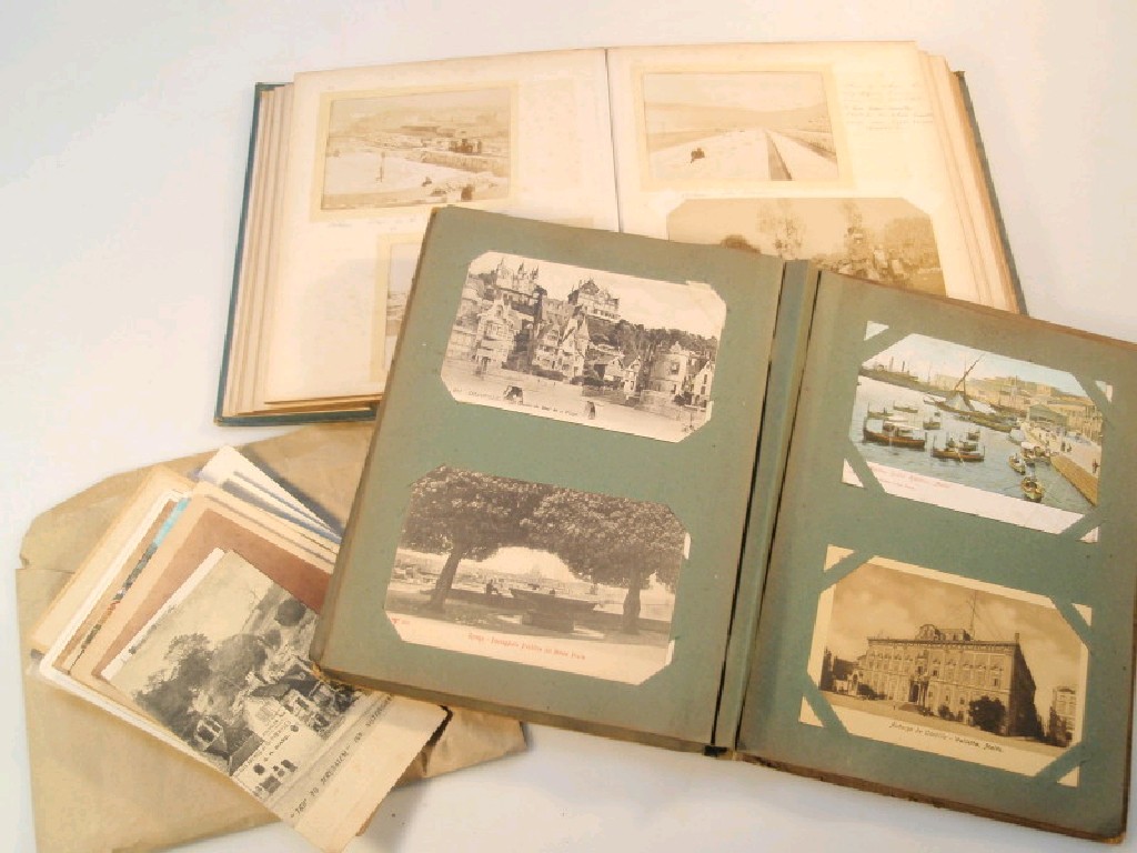 Appraisal: An early thC postcard album with approximately topographical cards mainly