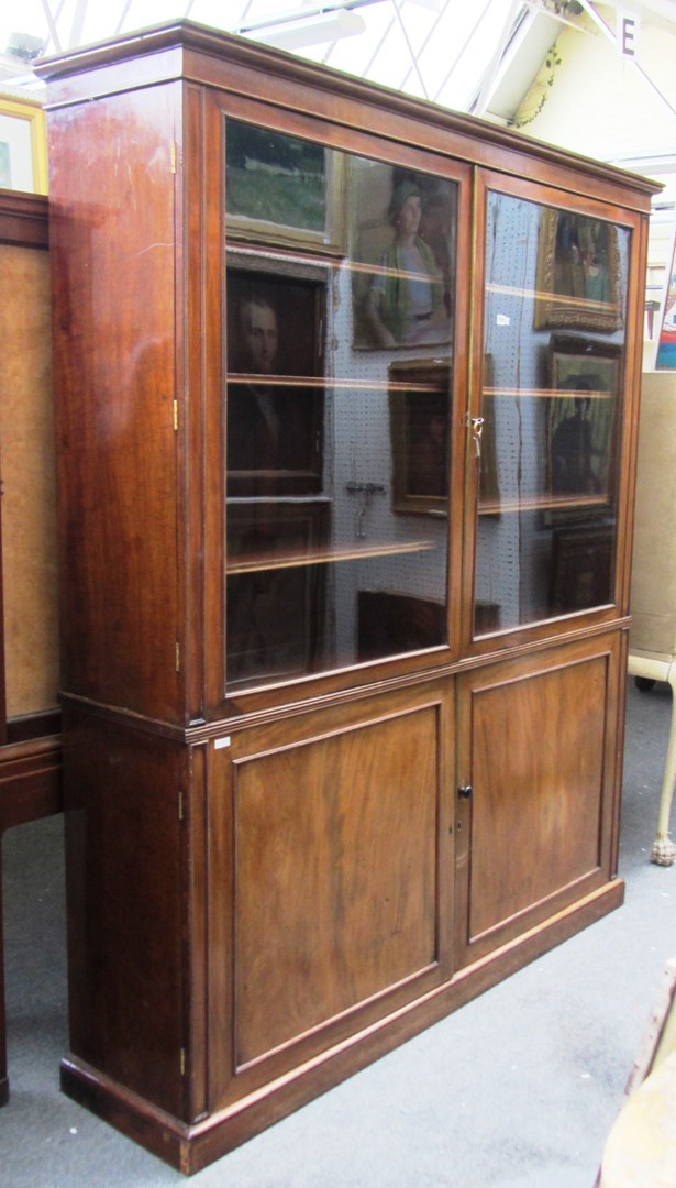 Appraisal: A Regency mahogany display cabinet the pair of glazed doors