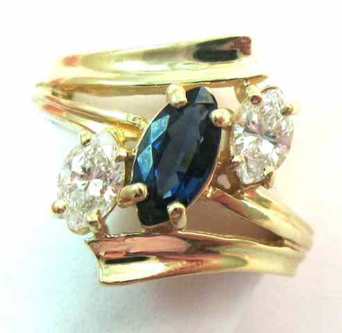 Appraisal: SAPPHIRE DIAMOND AND YELLOW GOLD RING The k gold ring