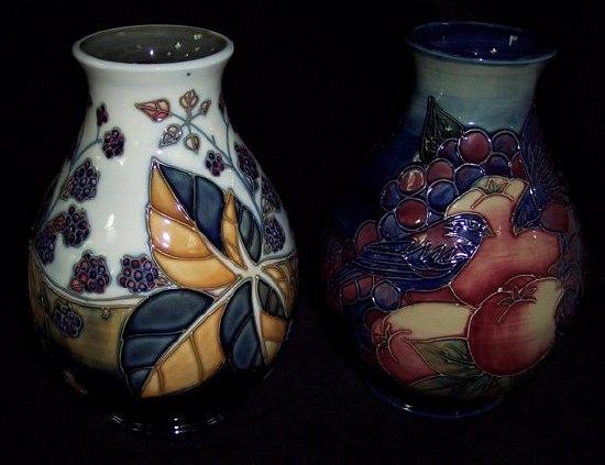 Appraisal: A Moorcroft 'Pomegranate and Finches' ovoid vase cm high and