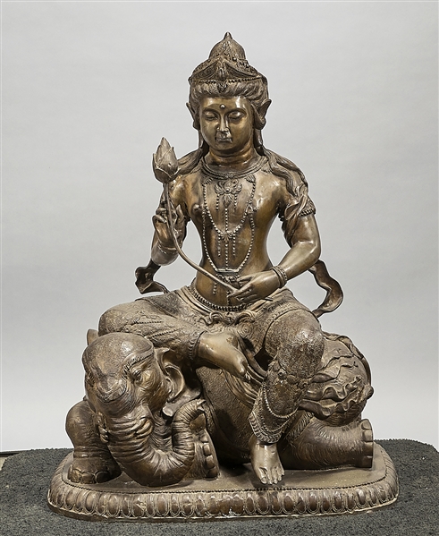 Appraisal: Chinese bronze sculpture of Guanyin seated on an elephant holding