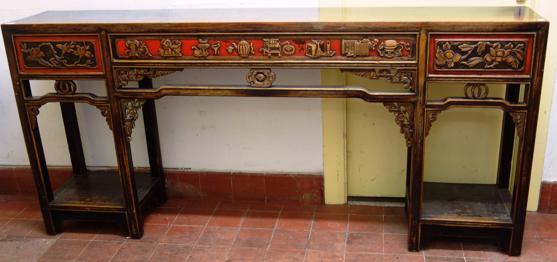 Appraisal: An early th century Chinese hardwood altar table with pierced