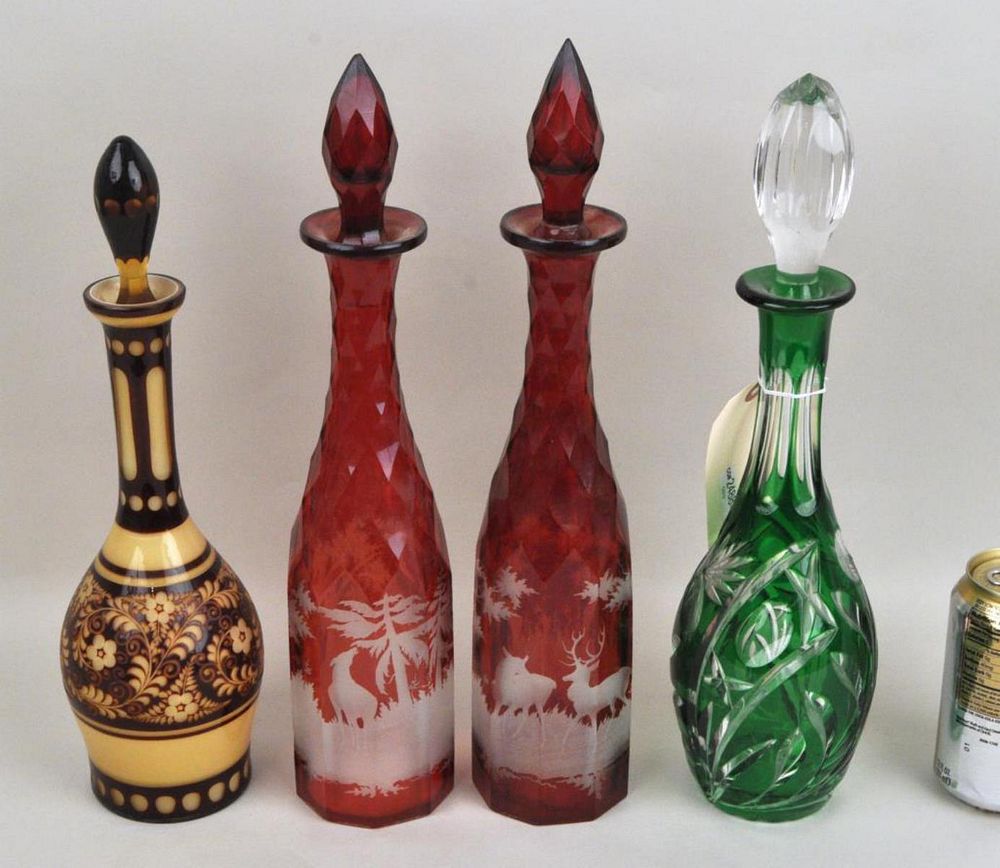 Appraisal: Group Four Cut and Colored Glass Decanters comprising a pair