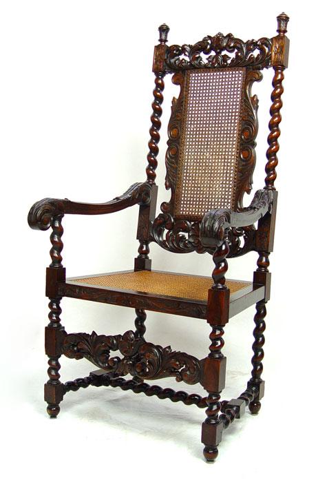 Appraisal: ELIZABETHAN STYLE HEAVILY CARVED CHAIR Caned seat back Barley twist