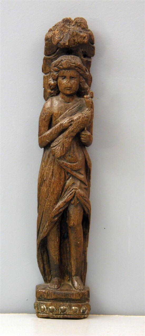 Appraisal: Antique oak relief carving of a woman holding a bird