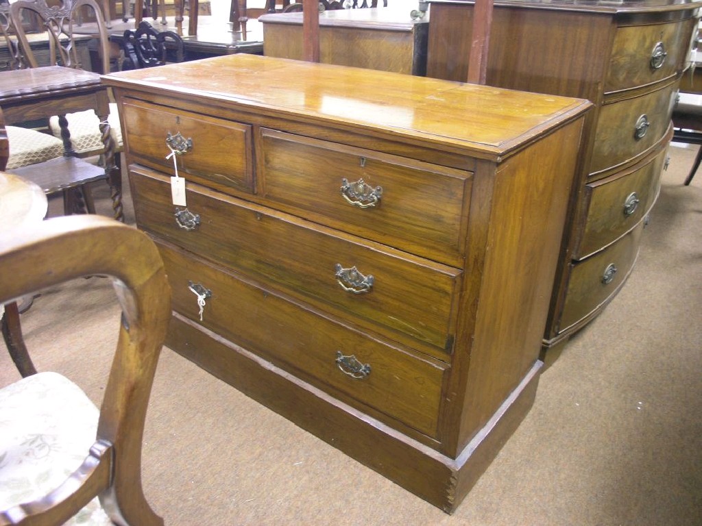 Appraisal: An Edwardian walnut dressing chest mirror above two short and