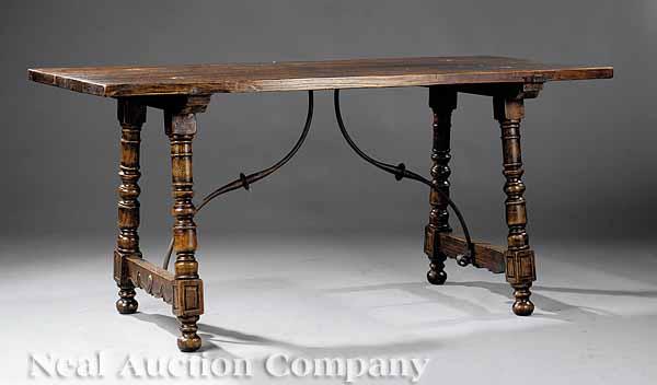 Appraisal: A Spanish Colonial-Style Walnut Center Table the thick plank top