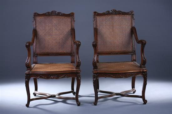 Appraisal: PAIR REGENCE STYLE FRUITWOOD FAUTEUILS th century with cane backs