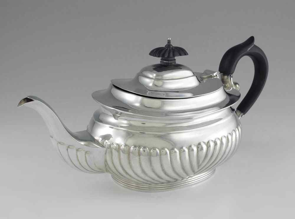 Appraisal: BIRKS STERLING SILVER TEAPOT Hinged lid with ebony finial embossed