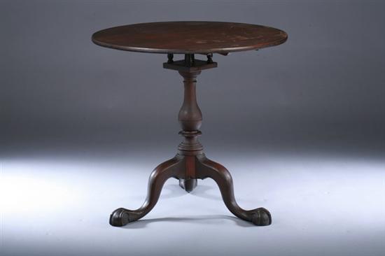 Appraisal: FEDERAL MAHOGANY TILT-TOP TEA TABLE th century Circular top baluster-turned