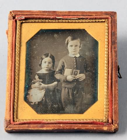 Appraisal: Sixth plate daguerreotype of a knees up portrait of two