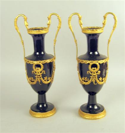 Appraisal: Pair of neoclassical style gilt metal mounted cobalt glass urns