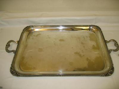 Appraisal: AN EDWARDIAN PLATED TEA TRAY of rounded oblong form the