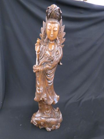 Appraisal: Chinese Large Carved Wooden Empress with sceptre fish at her