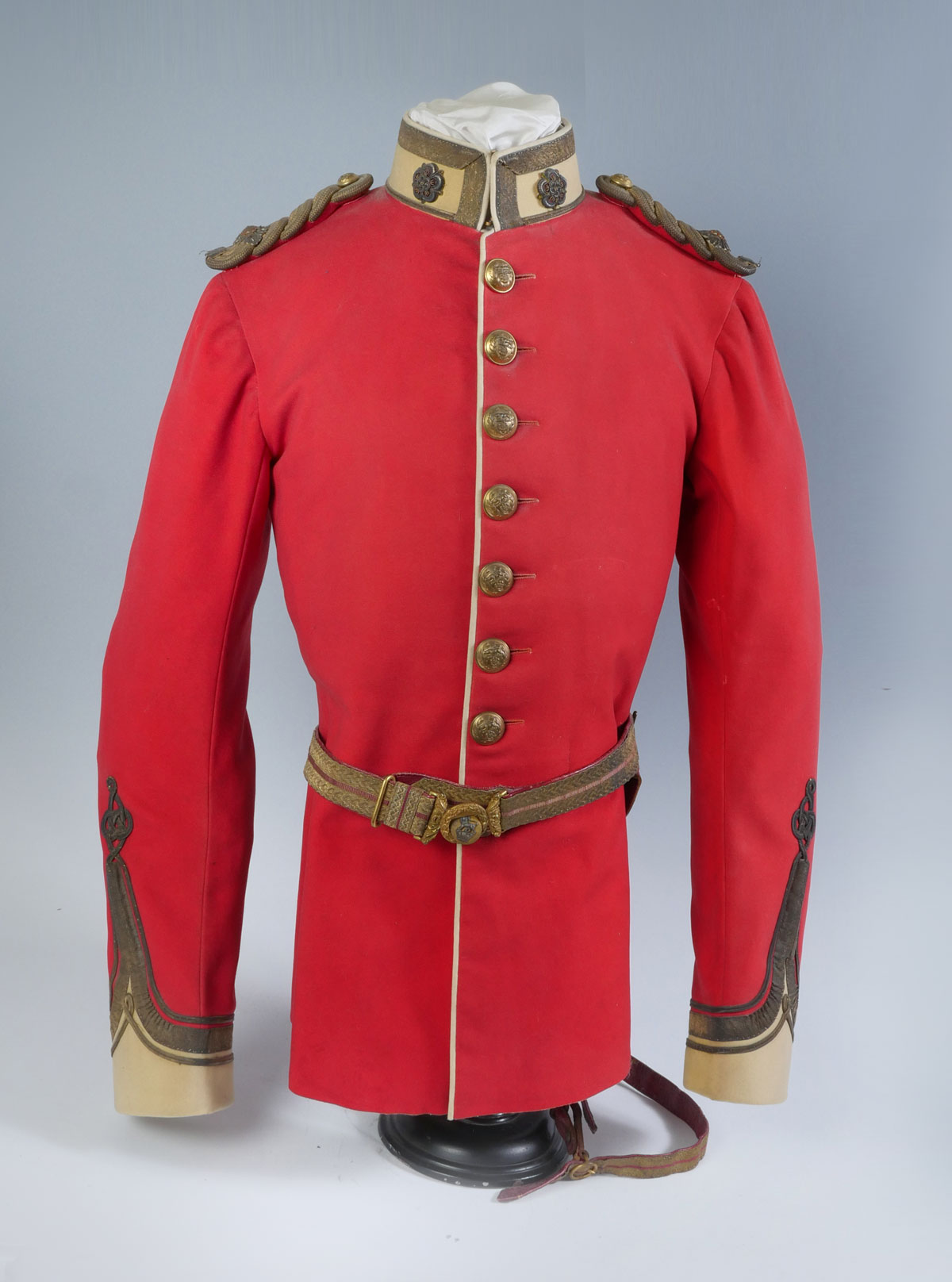 Appraisal: RED BRITISH MILITARY JACKET Resting on a formed stand with