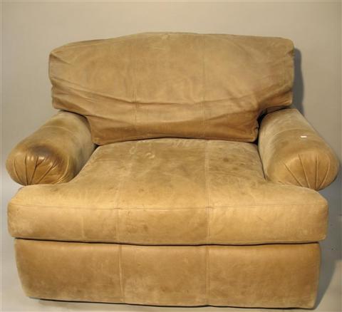 Appraisal: CENTURY FURNITURE LEATHER ARMCHAIR AND OTTOMAN th century the overstuffed