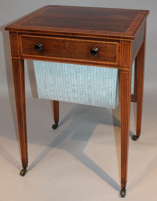 Appraisal: A Regency rosewood sewing table the rectangular top set with