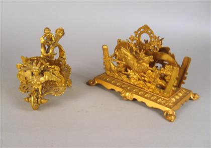 Appraisal: Two gilt bronze desk accessories Comprising a letter holder relief