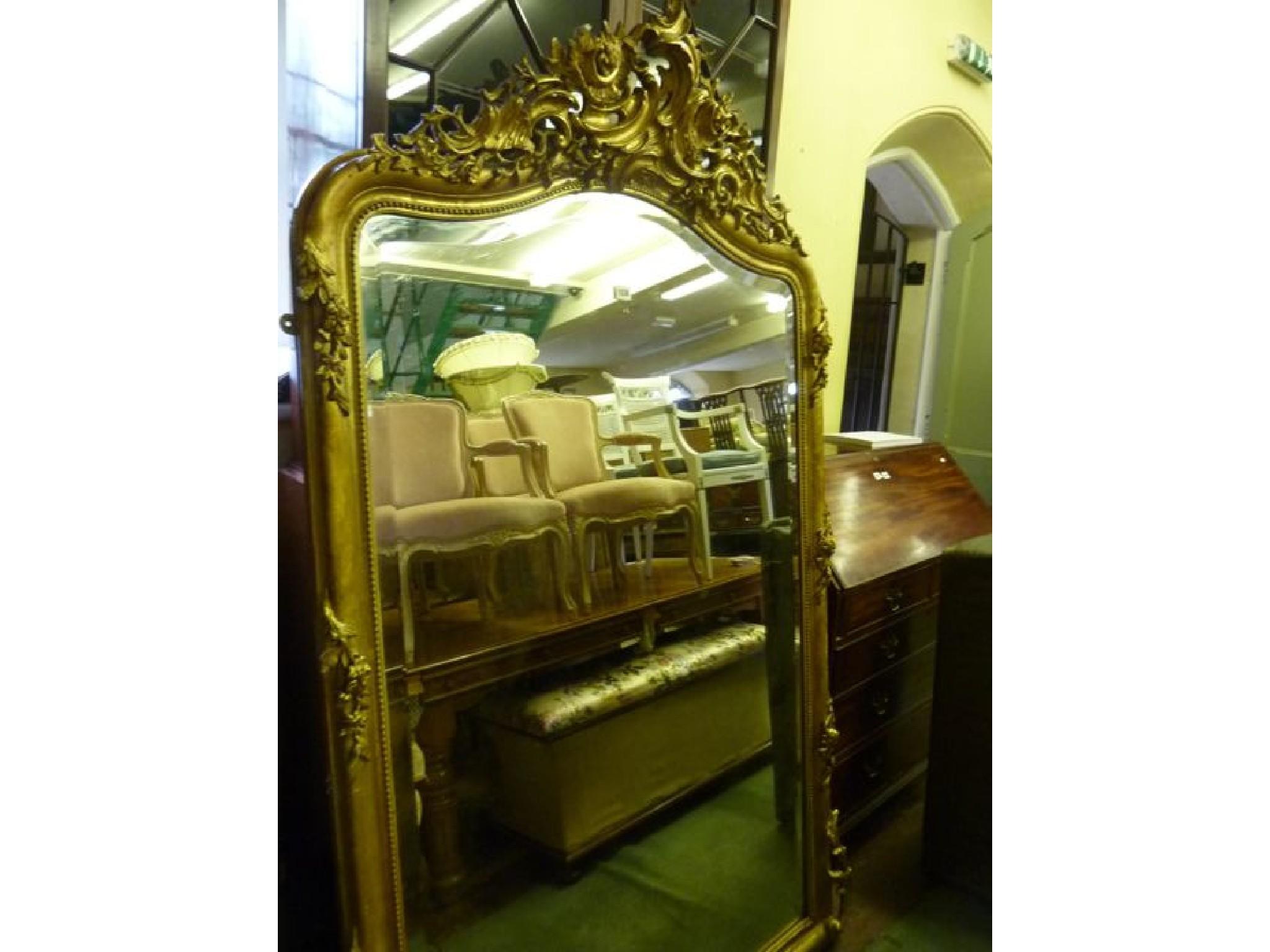 Appraisal: A th century gilt framed overmantle mirror of arched form