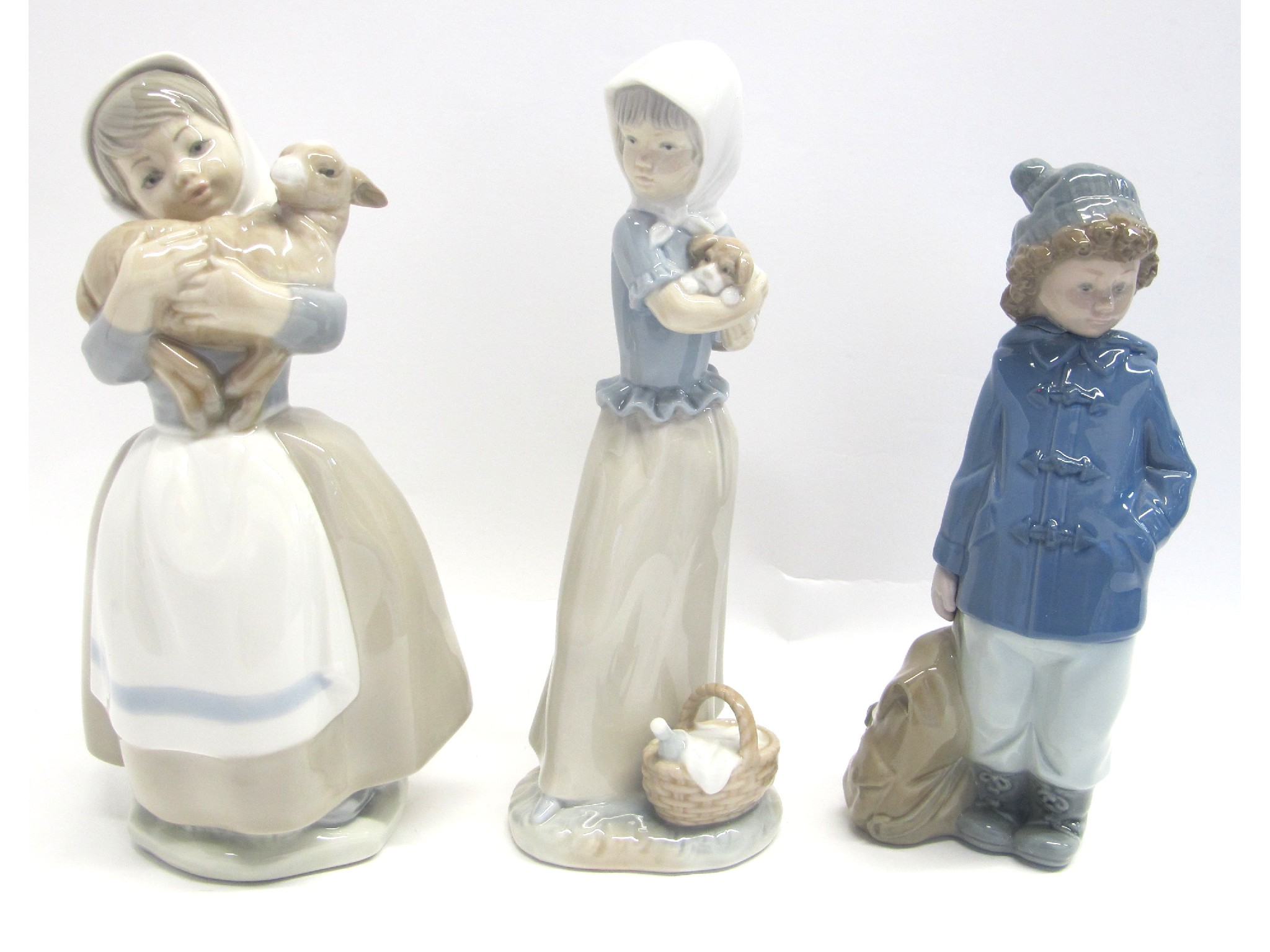 Appraisal: Three Lladro figures two of girls holding animals one of