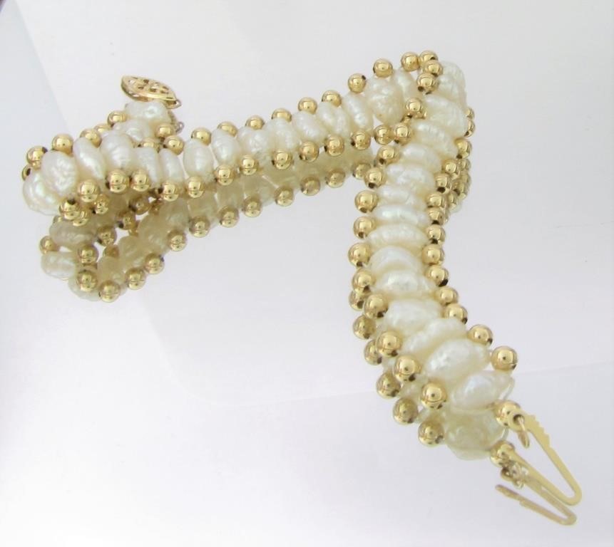 Appraisal: A K yellow gold bracelet with seed pearl and K