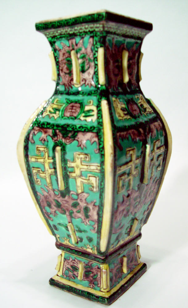 Appraisal: Chinese pottery vase of rectangular form relief moulded and enamelled