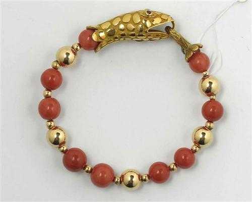 Appraisal: GOLD AND CORAL BRACELET Yellow gold und Decorative bracelet consisting