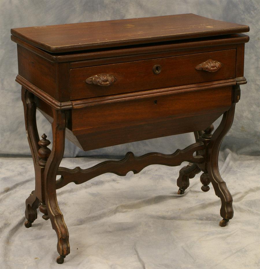 Appraisal: Walnut Victorian sewing table with fold over top and work