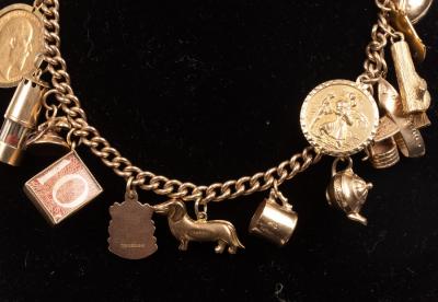 Appraisal: A ct yellow gold charm bracelet hung with a variety