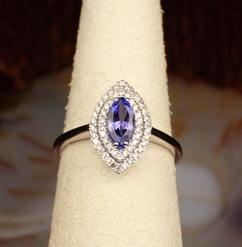 Appraisal: TANZANITE DIAMOND AND FOURTEEN KARAT GOLD RING The white gold