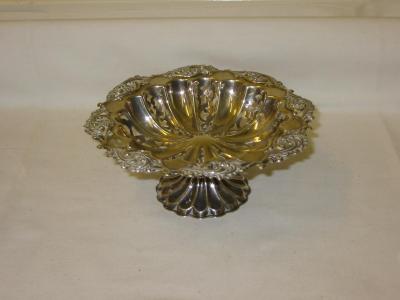 Appraisal: AM EDWARDIAN BONBON STAND of shaped circular form with scroll