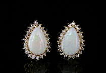 Appraisal: Opal Diamond Earrings For pierced ears pear shaped green fire