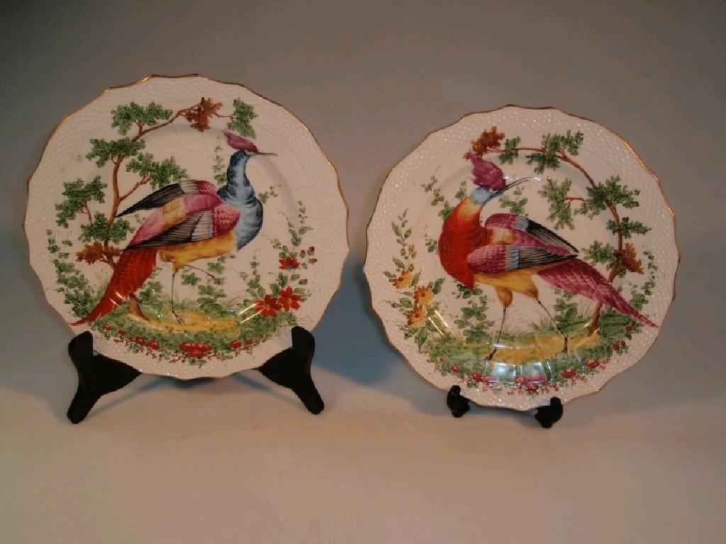 Appraisal: A pair of thC-style plates with hand painted bird decoration